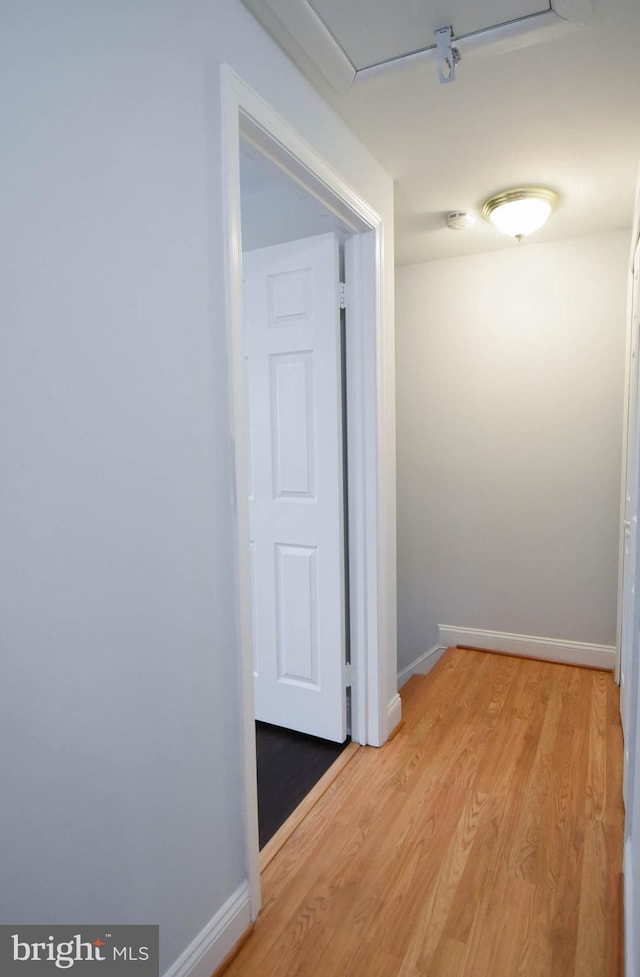 hallway featuring light hardwood / wood-style flooring