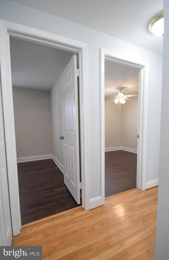 hallway with light hardwood / wood-style flooring