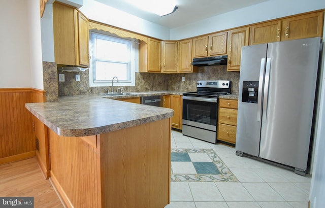 kitchen with sink, appliances with stainless steel finishes, ventilation hood, light tile patterned flooring, and kitchen peninsula