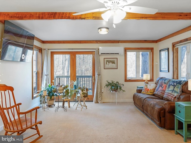 living room featuring beamed ceiling, an AC wall unit, a healthy amount of sunlight, and light colored carpet