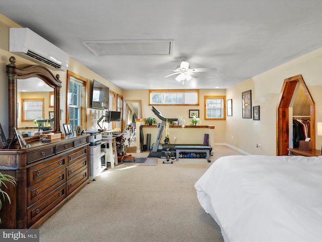 carpeted bedroom featuring an AC wall unit