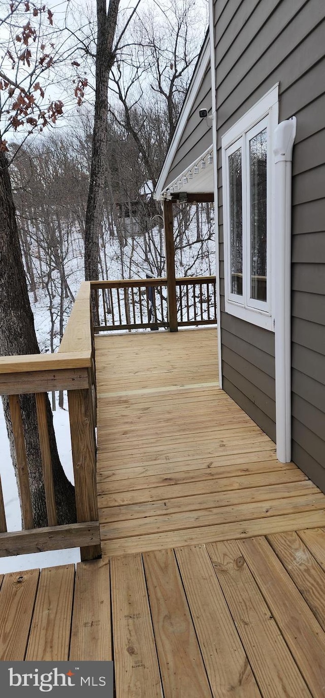 view of snow covered deck