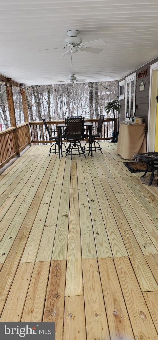 snow covered deck with ceiling fan