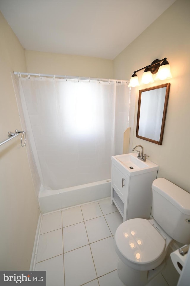 bathroom with toilet, tile patterned floors, and vanity