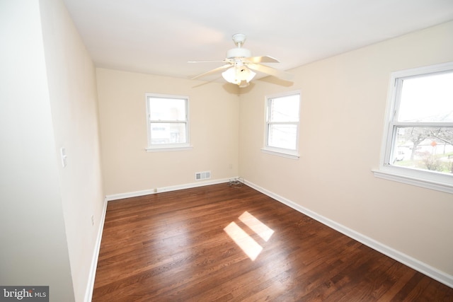 unfurnished room featuring ceiling fan and dark hardwood / wood-style floors