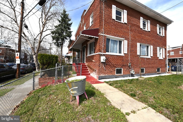 view of property exterior with a lawn