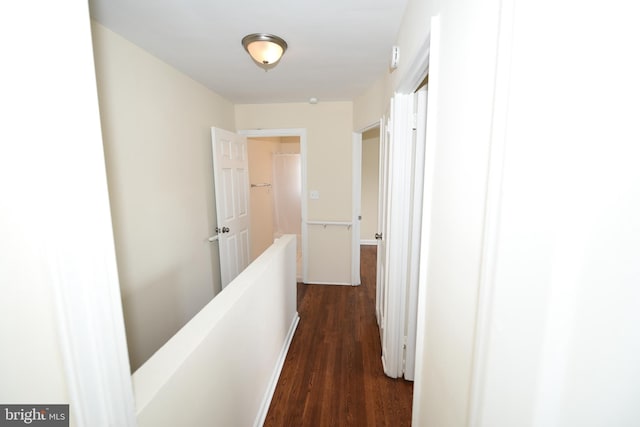 hallway with dark wood-type flooring