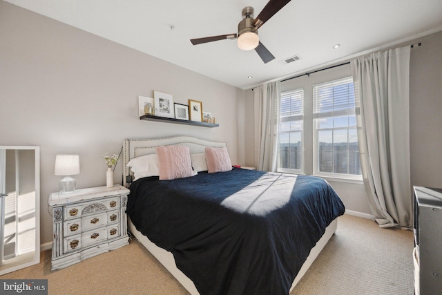 carpeted bedroom featuring ceiling fan