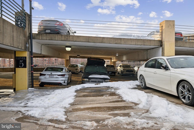 view of snow covered parking