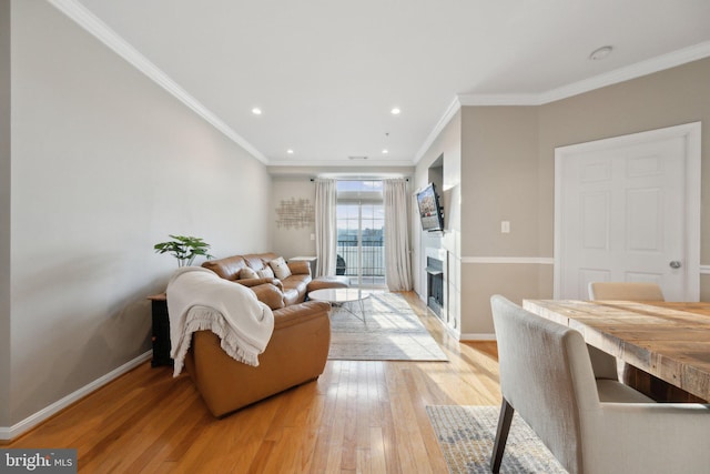 living room featuring wood-type flooring and crown molding