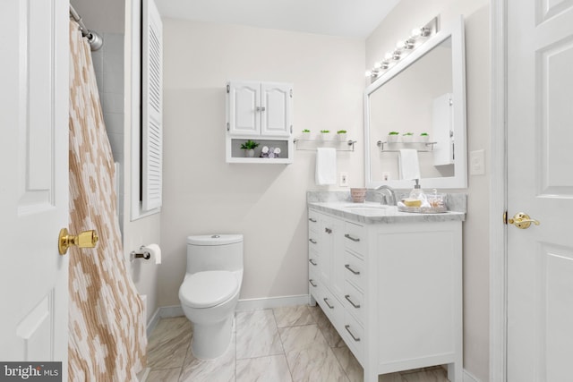 bathroom with toilet and vanity