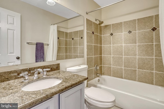 full bathroom with toilet, vanity, and shower / tub combo with curtain