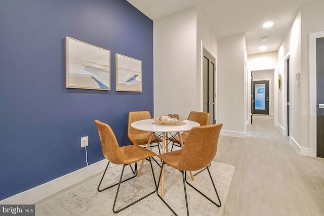 dining room with light hardwood / wood-style flooring