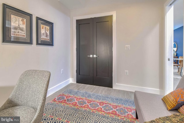 bedroom with wood-type flooring and a closet