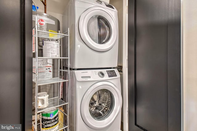 clothes washing area featuring stacked washer and dryer