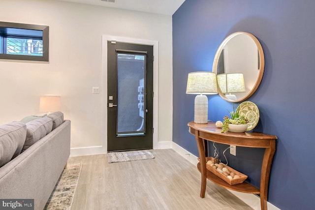 foyer with light hardwood / wood-style flooring