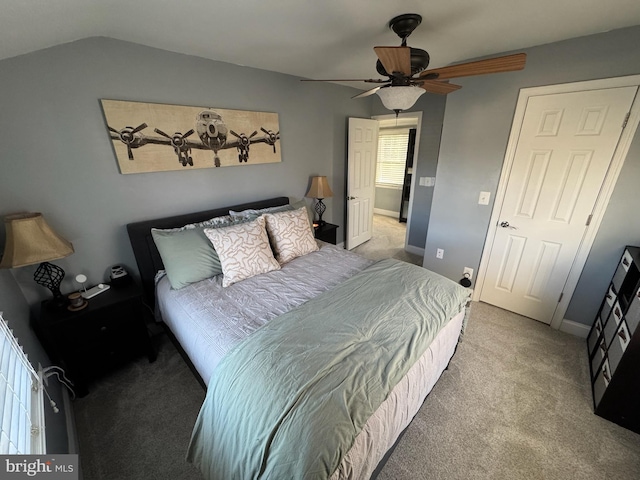 bedroom with lofted ceiling, light carpet, and ceiling fan