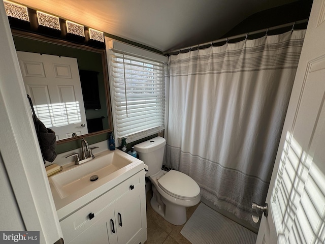 bathroom featuring tile patterned flooring, vanity, and toilet