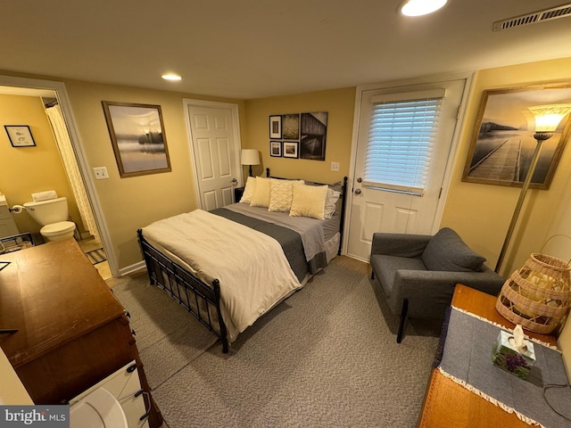 carpeted bedroom with ensuite bathroom