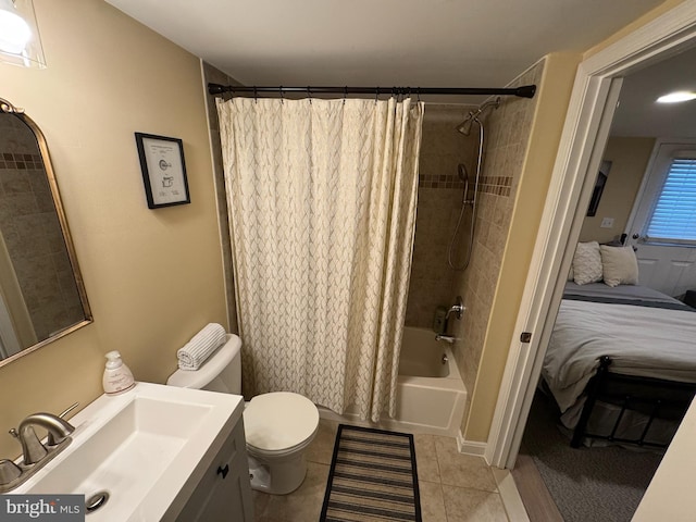 full bathroom featuring tile patterned flooring, vanity, toilet, and shower / bathtub combination with curtain