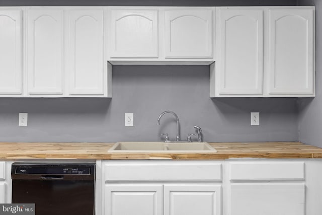 kitchen featuring wood counters, white cabinetry, dishwasher, and sink