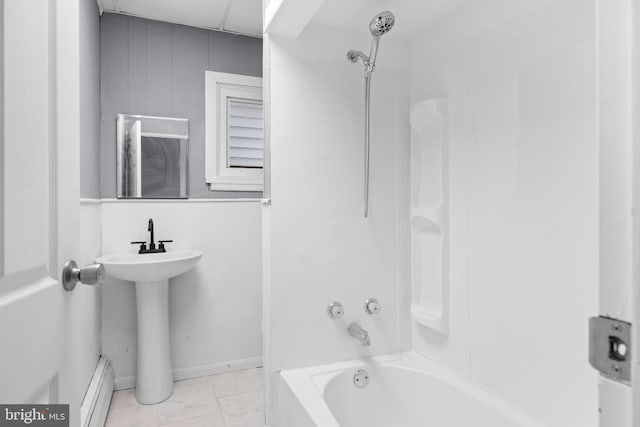 bathroom with a baseboard heating unit and  shower combination