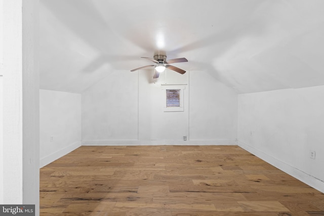 additional living space with ceiling fan, lofted ceiling, and hardwood / wood-style floors