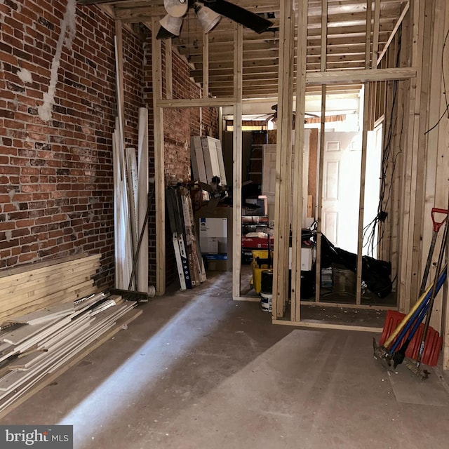 misc room with concrete flooring and ceiling fan