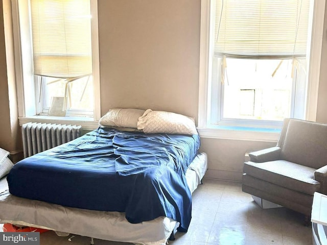 bedroom featuring radiator