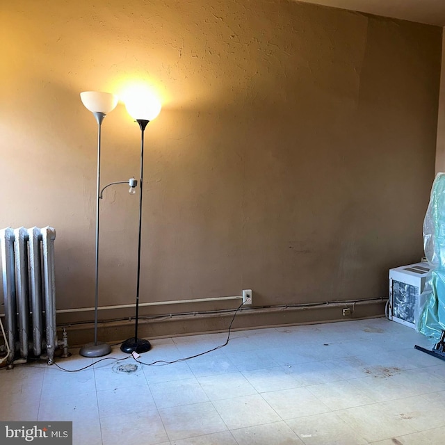 unfurnished room with radiator