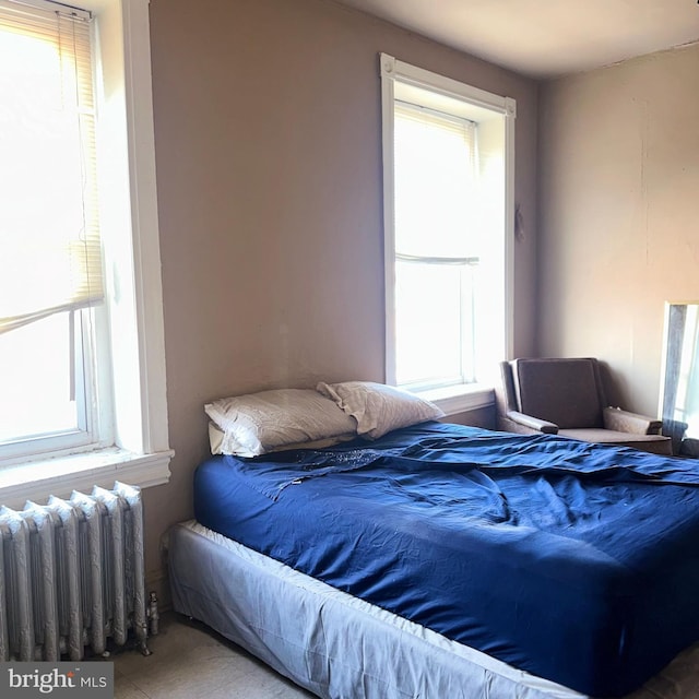 bedroom featuring radiator heating unit