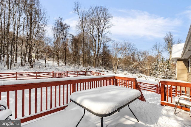 view of snow covered deck