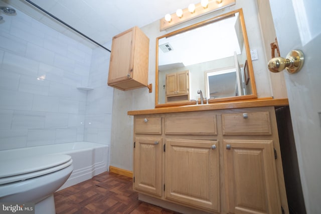 full bathroom featuring parquet flooring, toilet, vanity, and tub / shower combination