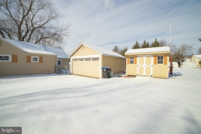 view of snow covered garage