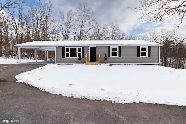 view of front of home with a carport