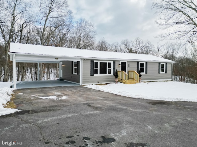 view of front of home with a carport