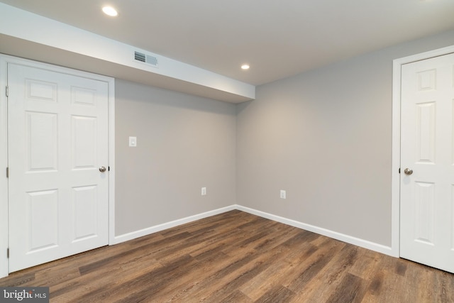 basement featuring dark hardwood / wood-style floors