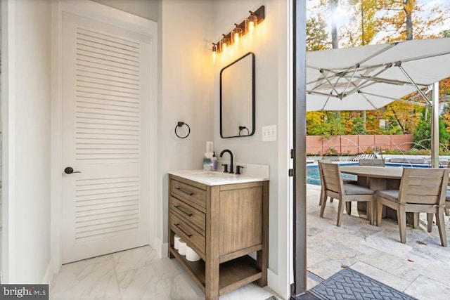 bathroom featuring a wealth of natural light and vanity