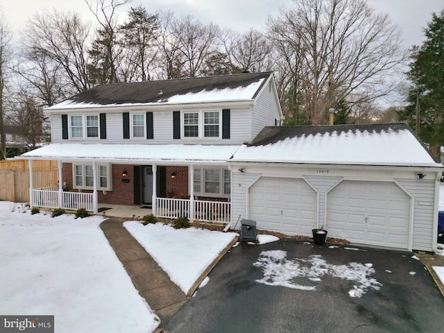 view of front of property with a garage and a porch