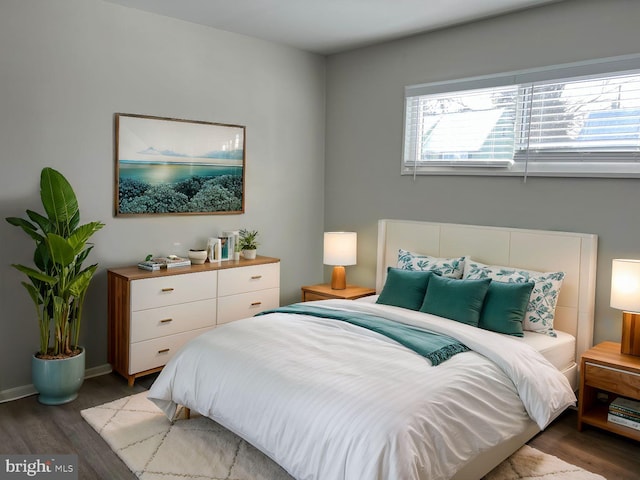 bedroom with wood-type flooring