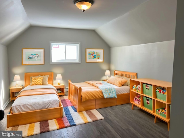 bedroom with lofted ceiling and dark hardwood / wood-style flooring