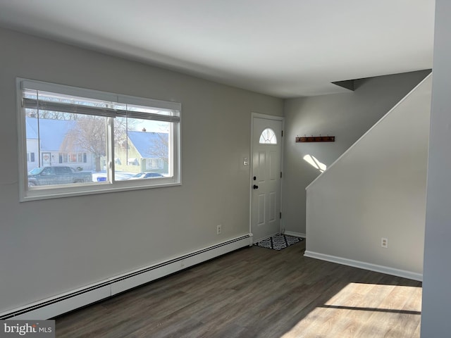 entrance foyer with dark hardwood / wood-style flooring and a baseboard radiator