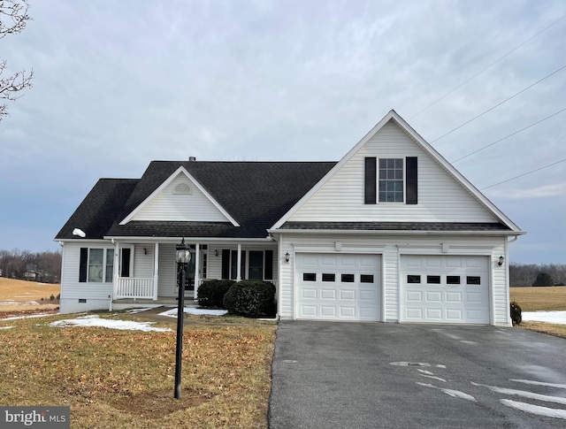 view of front of property with covered porch and a garage