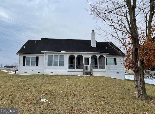 rear view of property with a porch and a lawn