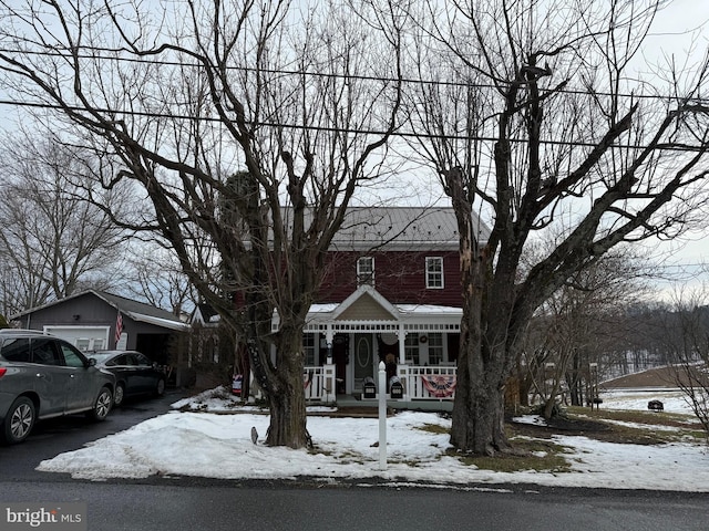 view of front of house with a porch and a garage