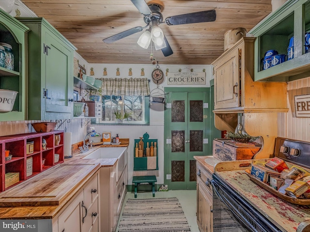 kitchen with wood counters, sink, green cabinetry, range, and wooden ceiling