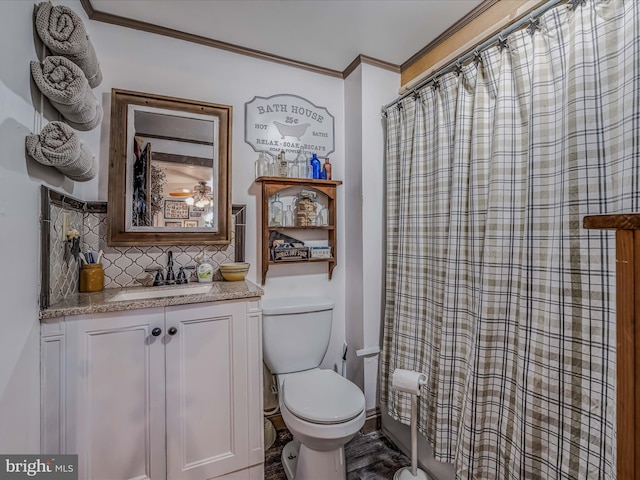 bathroom with decorative backsplash, ornamental molding, vanity, toilet, and a shower with shower curtain