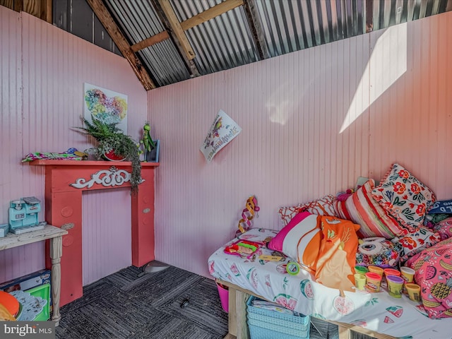 bedroom featuring lofted ceiling