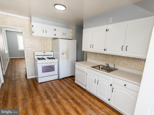 kitchen featuring sink, dark wood-type flooring, white cabinets, and white appliances