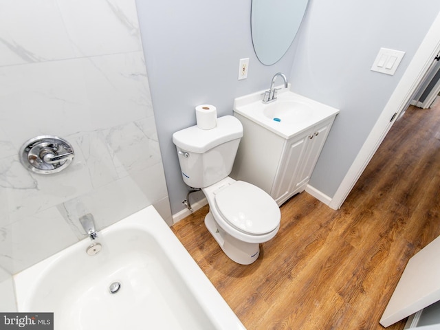 bathroom with vanity, hardwood / wood-style flooring, and toilet